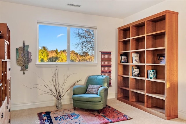 living area with light carpet