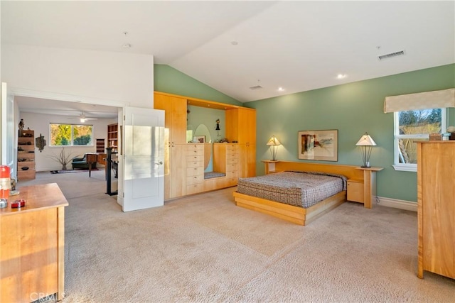 carpeted bedroom featuring lofted ceiling