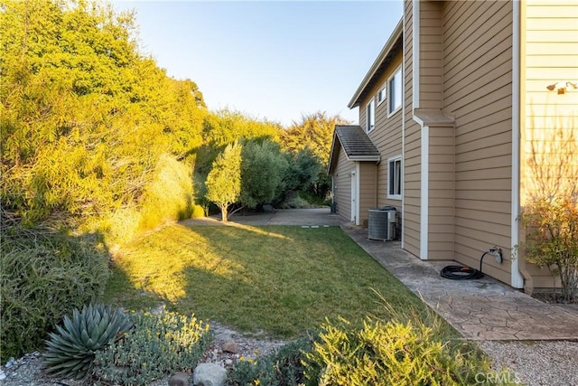 view of yard with central AC unit