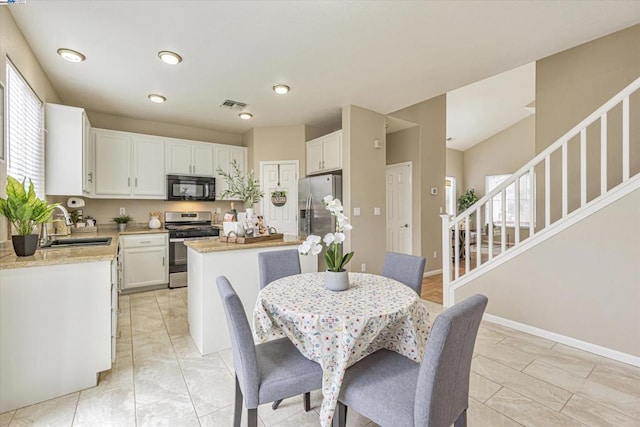 dining space featuring sink