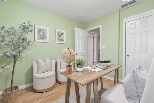 office area with hardwood / wood-style floors