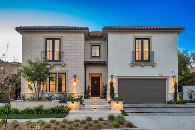 mediterranean / spanish-style home featuring a garage