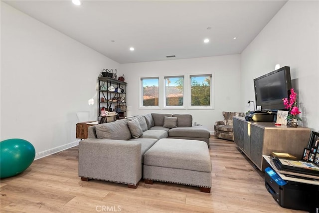 living room with light hardwood / wood-style floors