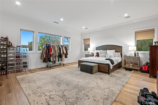 bedroom featuring wood-type flooring and ornamental molding