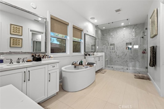 bathroom featuring vanity, tile patterned floors, and shower with separate bathtub