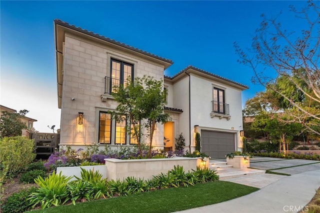 mediterranean / spanish-style home featuring a garage