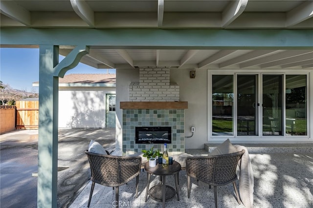 view of patio with a tile fireplace