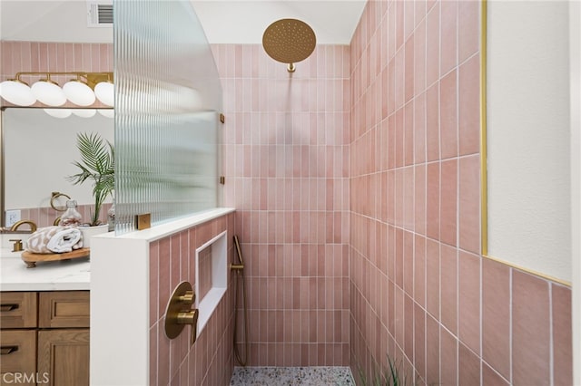 bathroom with a tile shower