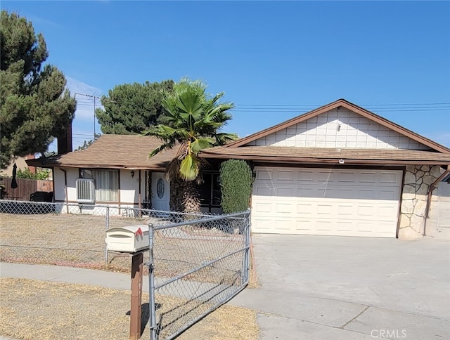 single story home with a fenced front yard, driveway, an attached garage, and central AC unit