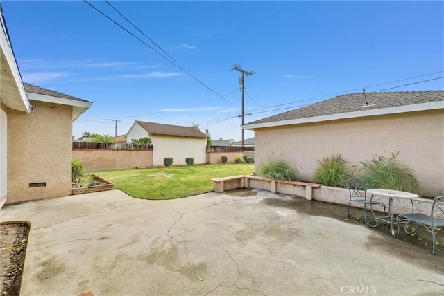 view of patio / terrace with fence and an outdoor structure