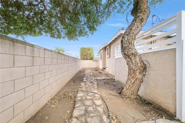 view of property exterior featuring a fenced backyard and stucco siding