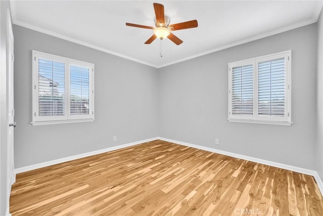 empty room featuring crown molding, ceiling fan, and light hardwood / wood-style floors