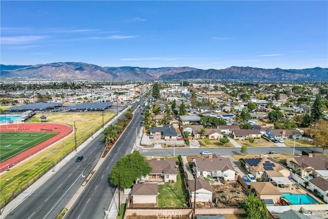 birds eye view of property with a residential view and a mountain view