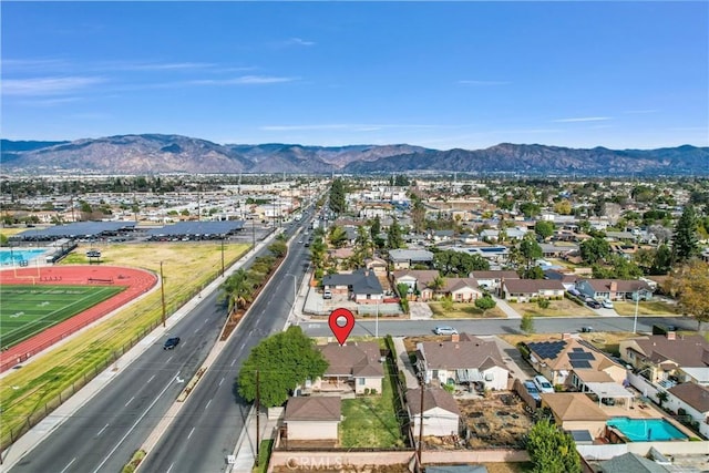 birds eye view of property with a mountain view