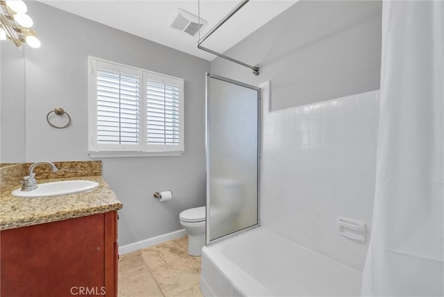 bathroom featuring tile patterned flooring, vanity, and toilet