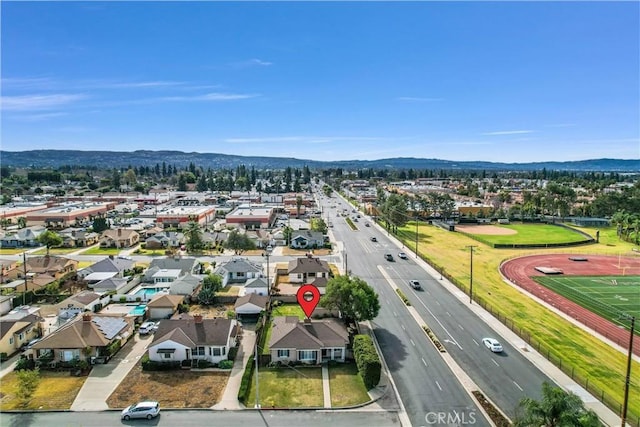 birds eye view of property featuring a mountain view