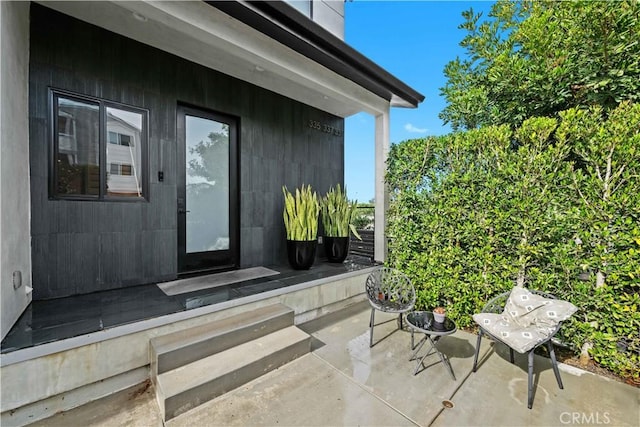 doorway to property with a patio area