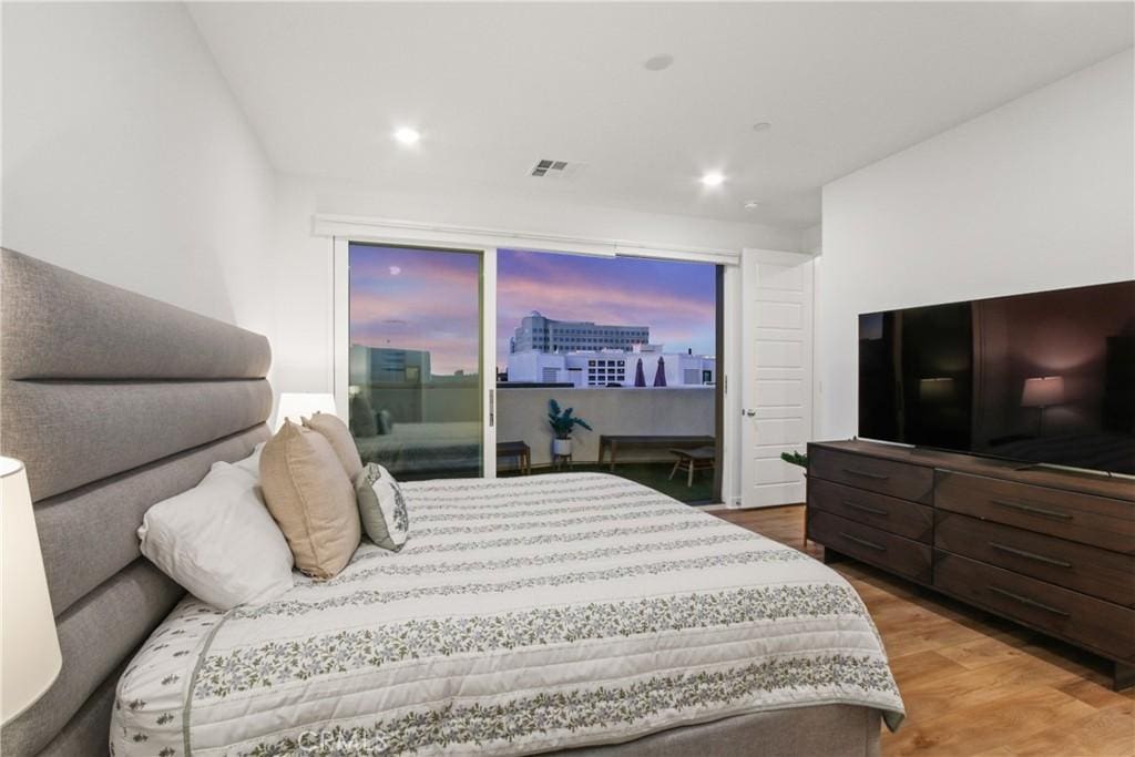 bedroom featuring hardwood / wood-style flooring