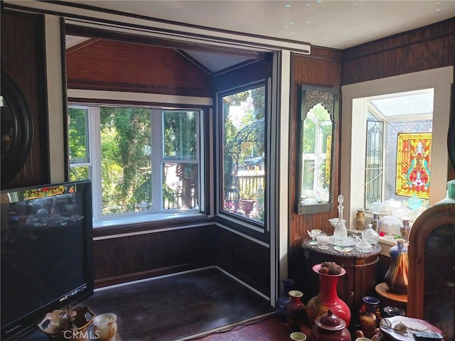 sunroom featuring lofted ceiling