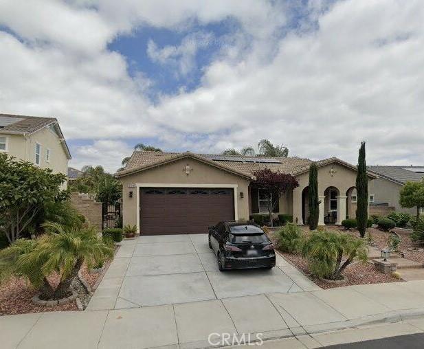 mediterranean / spanish-style home featuring a garage