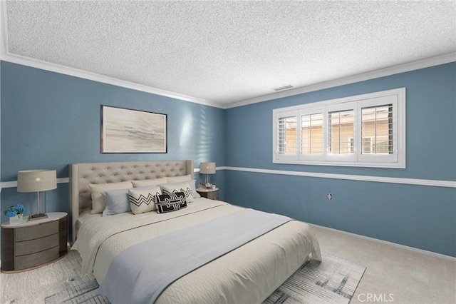 carpeted bedroom with ornamental molding, visible vents, a textured ceiling, and baseboards