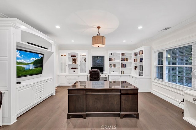 office area featuring dark wood-type flooring and crown molding