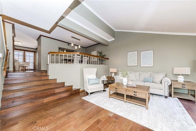 living room with ornamental molding and wood-type flooring