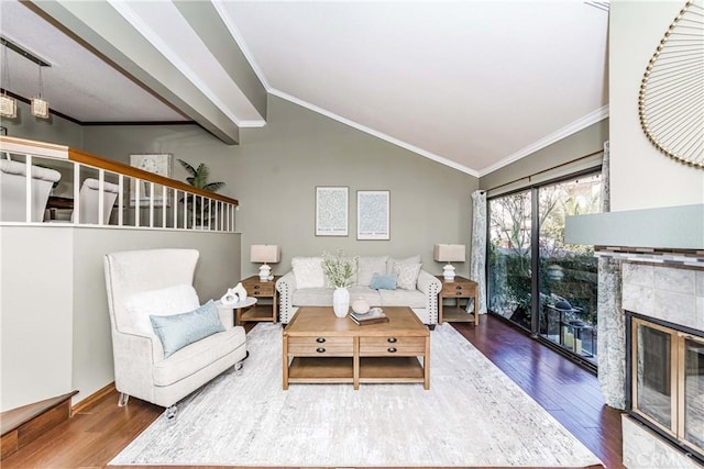 living room with dark hardwood / wood-style flooring, crown molding, and a fireplace