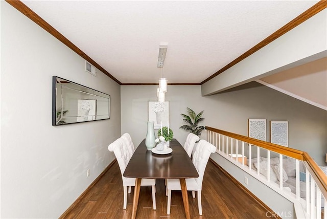 dining area featuring crown molding and dark hardwood / wood-style floors