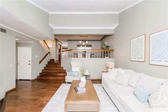 living room with crown molding and wood-type flooring