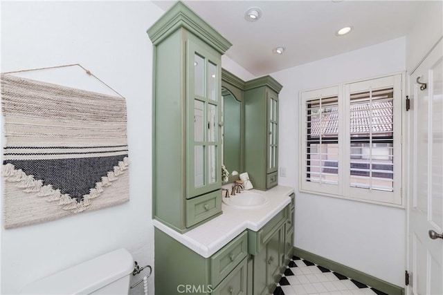 bathroom featuring vanity and toilet