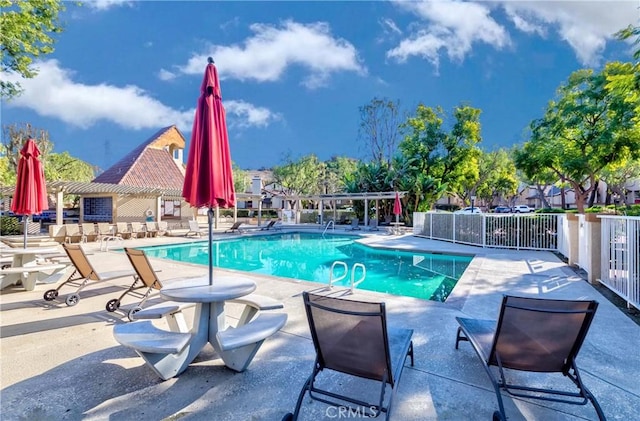 view of pool featuring a pergola and a patio area