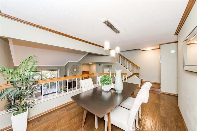 dining area featuring crown molding and wood-type flooring