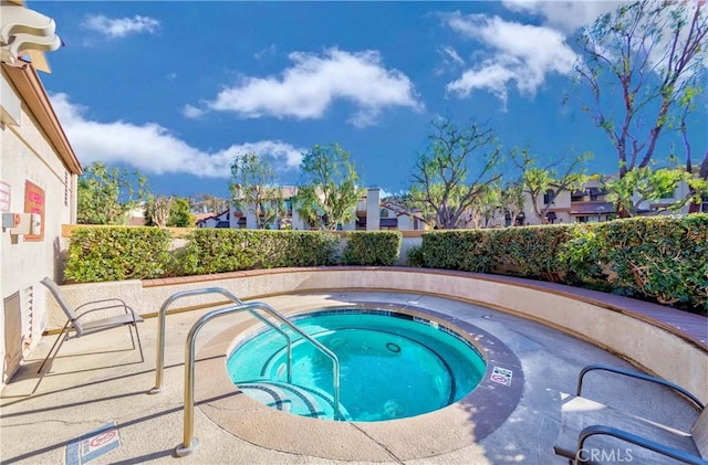 view of pool featuring a hot tub