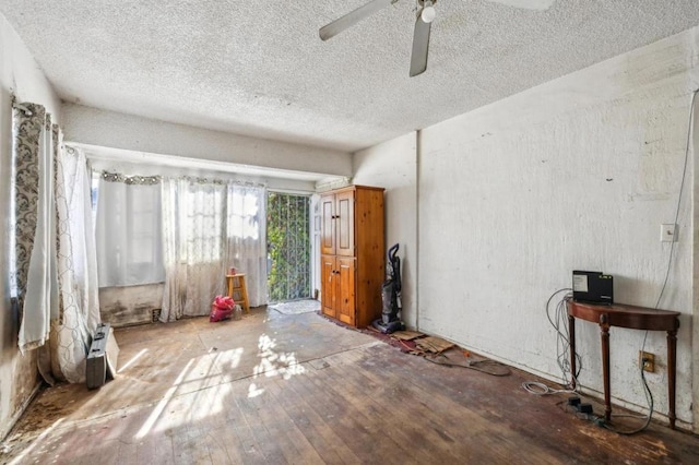 interior space with hardwood / wood-style flooring and ceiling fan