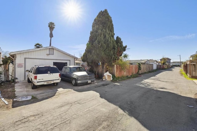 view of front of property featuring a garage and an outdoor structure