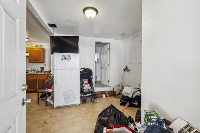 interior space featuring white fridge