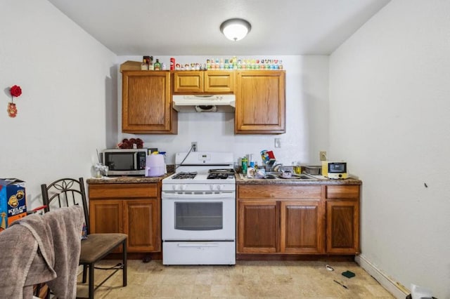 kitchen with sink and white gas range oven