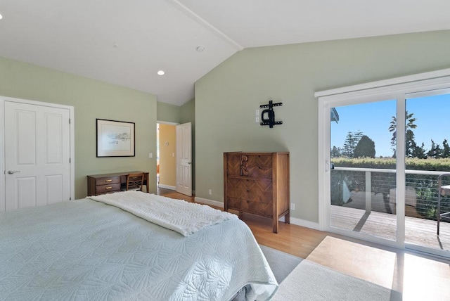 bedroom with lofted ceiling, access to exterior, and light wood-type flooring