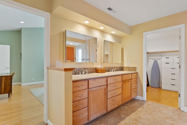 bathroom featuring vanity and wood-type flooring