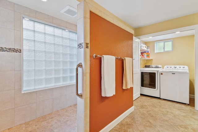 washroom featuring separate washer and dryer