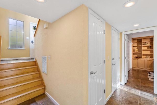 hallway with built in shelves