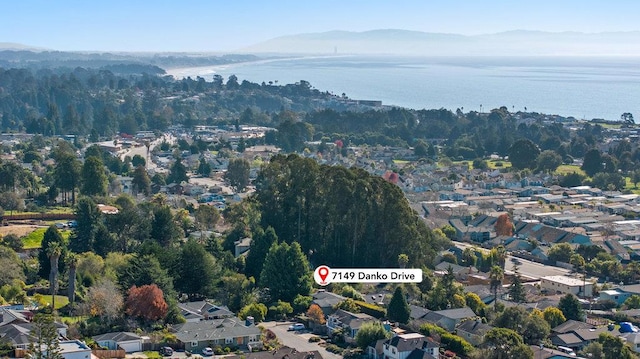 drone / aerial view with a water and mountain view