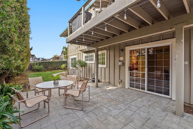 view of patio featuring a balcony