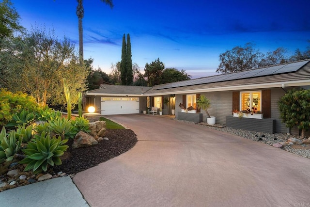 ranch-style home with a garage