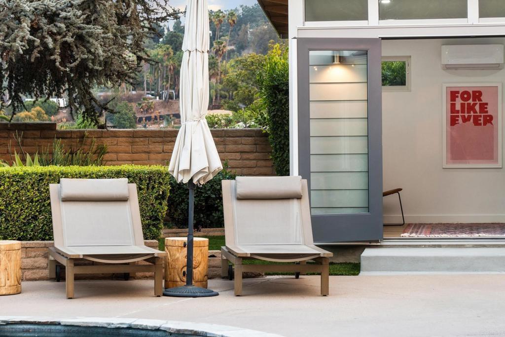 view of patio / terrace featuring an AC wall unit