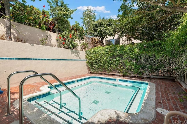 view of swimming pool featuring a patio area