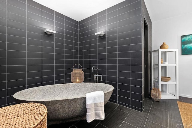 bathroom with tile walls and tile patterned floors