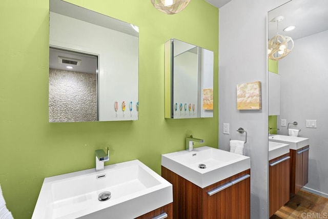 bathroom featuring vanity and hardwood / wood-style floors