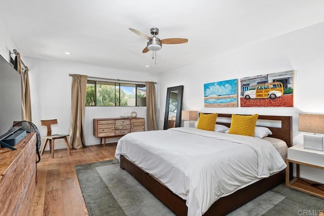 bedroom with ceiling fan and wood-type flooring